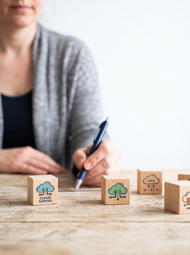 Remote work home asynchronous communication cloud computing data storage network technology office table woman hand pen wooden block cube