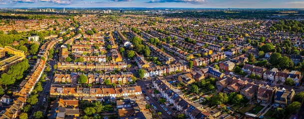 West Ealing Suburb with dense housing and green streets in London England © Alexey Fedorenko