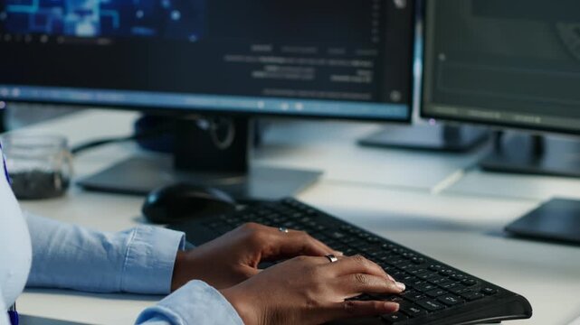 Data center admin using PC to find misconfigurations while capturing firewall review, server bottlenecks and technical problem solving.