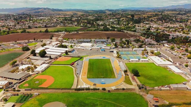 Drone over school sports complex in Arroyo Grande showing running track and football field