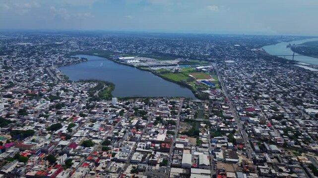 Aerial drone panoramic view of Tampico showing Carpintero lagoon center and Panuco river with urban residential architecture