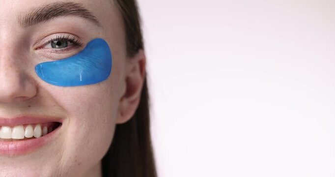 Beautiful woman with eye patch on white background, closeup