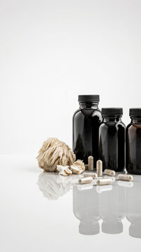 Lion's Mane mushroom supplement bottles with capsules and dried fruiting body