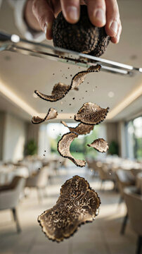 Black truffle being sliced and displayed in upscale restaurant setting