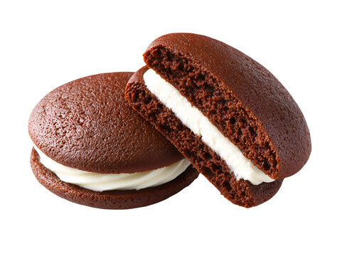 Chocolate whoopie pie with fluffy vanilla cream filling, one whole and one halved, isolated on a white background.