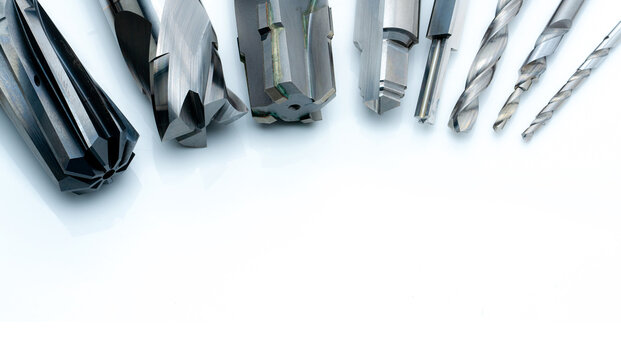Special tools isolated on white background. Made to order special tools. Coated step drill and reamer detail. HSS cemented carbide. Carbide cutting tool for industrial applications. Engineering tools.
