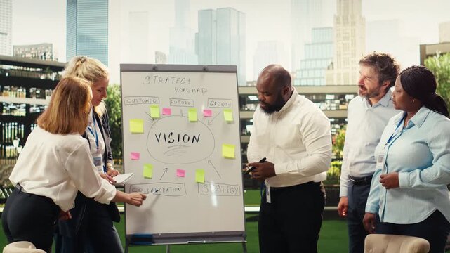 Portrait of diverse business team planning project timeline on whiteboard during outdoor presentation, informal discussion, adding sticky notes and discussing goals, for business planning.