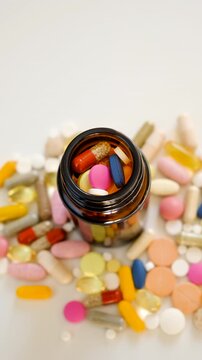 Various tablets and capsules, supplements and vitamins. Selective focus.
