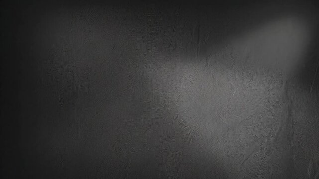 Dark gray textured wall background loop footage with dramatic spotlight from top left corner.