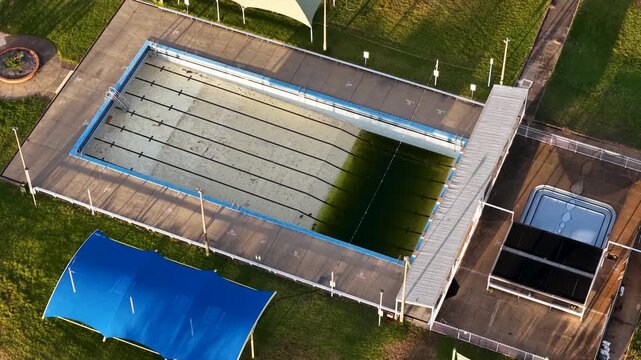 Aerial View of Abandoned Public Swimming Pool with Algae