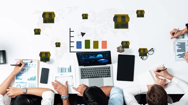 Diverse Group of Professionals Analyzing Market Trends and Business Growth Strategies with Charts and Graphs on a White Desk Gluon.