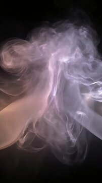 Cinematic wispy smoke motion graphics background loop with atmospheric orange and purple lighting