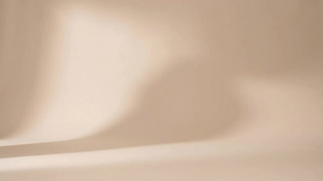 Minimalist beige studio background loop for professional product showcase footage.