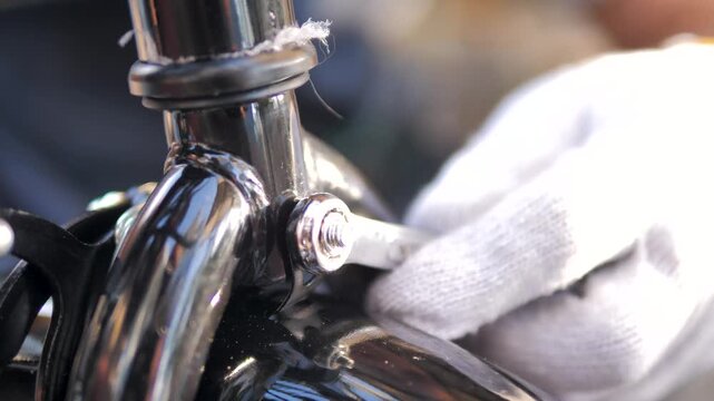4K UHD Close up of tightening a bicycle brake caliper bolt using a wrench. For bicycle maintenance, repair, mechanical service, and cycling concepts