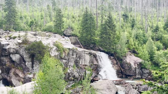 Hrebienok Waterfall in High Tatras Slovakia

Crystal-clear mountain waterfall flowing over granite boulders in Hrebienok, 
surrounded by alpine forest beneath the High Tatras, Slovakia, 20 July 2026.
