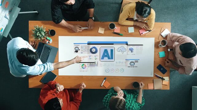 Collaborative Business Meeting on Artificial Intelligence Strategy with Diverse Professionals Analyzing Data and Visuals from Above Sigmoid