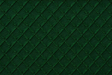 Obraz premium Deep emerald green quilted textured background with subtle weave detail and diamond pattern