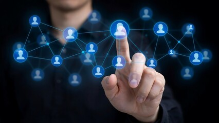 Obraz premium A person's hand interacting with a digital network of people icons, representing connections and social networking