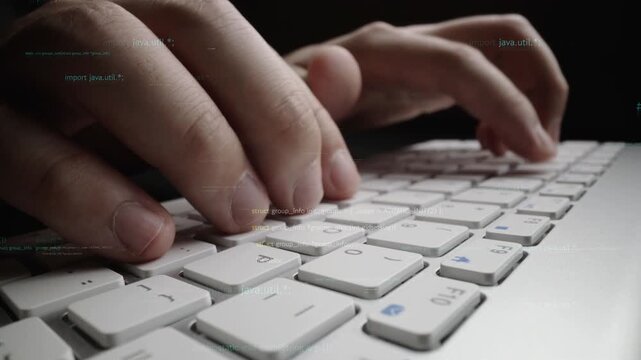 Close-up view of hands typing on a keyboard, surrounded by glowing lines of code, showcasing the interface of software development in a modern digital workspace. Xenic