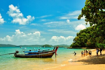 Obraz premium Thailand - Krabi - Ao Nang Beach July 22nd 2026. This was on a beautiful morning during the wet season. The Andaman sea during the low season surrounded by beautiful mountains.