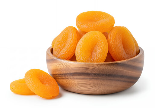 A dried apricot halves in a wooden bowl, isolated on a pure white background