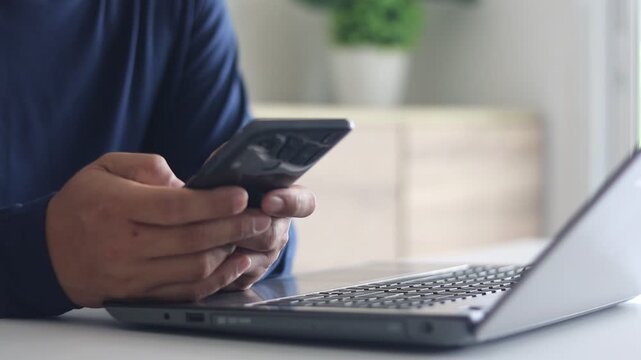 Close-up of man hand holding smartphone spend free time online using mobile apps. Client of e-commerce easy distant shopping, electronic services buyer, chat on-line. Solve business remotely concept.