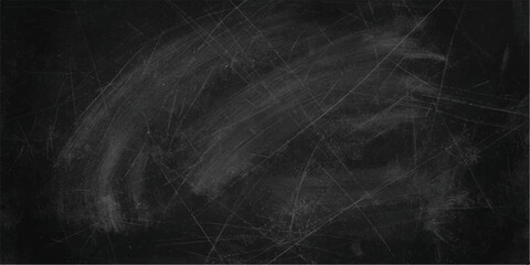 A blackboard surface with chalk dust and scratch marks, suggesting a space for learning or creative thought, ready to be written upon. © Mr Monster