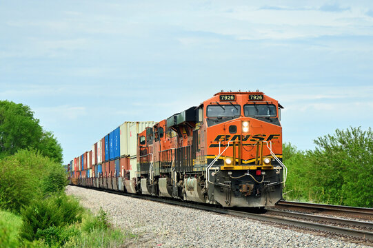 Three Burlington Northern Santa Fe locomotive umits lead an eastbound intermodal freight train through a rural section of north central Illinois.