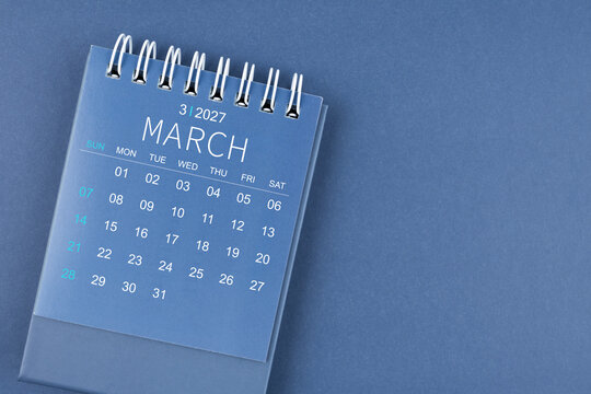 March 2027 calendar on blue color background. Desk calendar for planning.