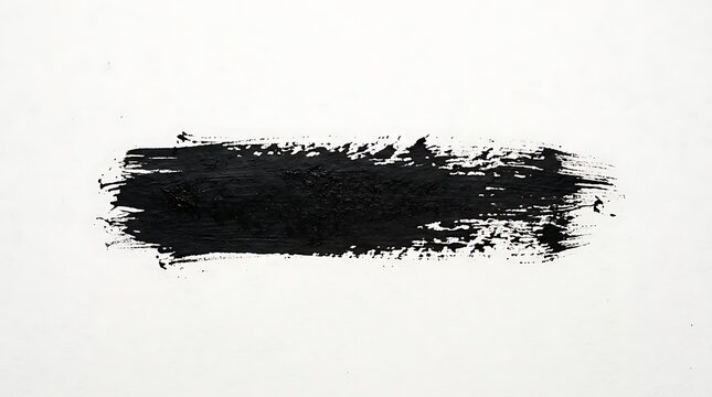 A horizontal black paint brush stroke isolated on a white background with a rough textured artistic finish
