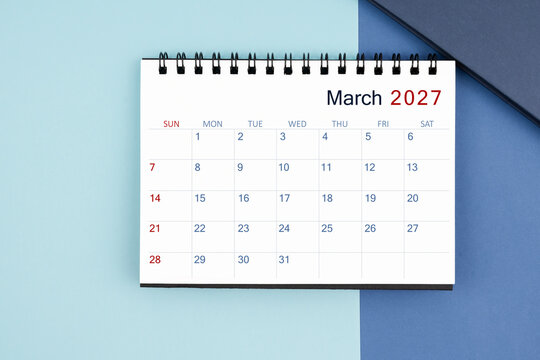 March 2027 monthly desk calendar for 2025 year on blue background.