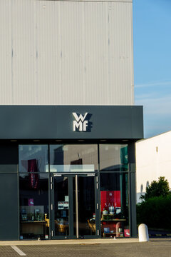 Mulheim Karlich, Germany - July 13, 2026: Exterior view of a WMF outlet store showcasing the WMF logo, modern architecture, and a Sale sign in the window