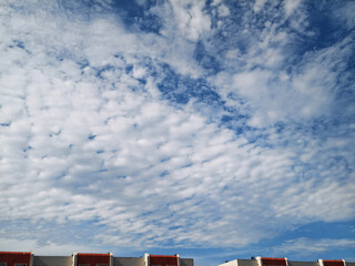 Fototapeta premium Dramatic Clouds Above Residential Rooftops 
