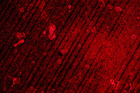 Dark red abstract grunge texture background with blood splatters.Dramatic high-contrast red and black abstract texture background with linear patterns, scratches, and stained splatters.