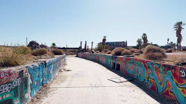 A slow drift down what once was a Lazy River at Lake Dolores Waterpark. Abandoned long ago the drones visual exposes what Vandals and a brutal desert sun have done to the once popular Ca destination