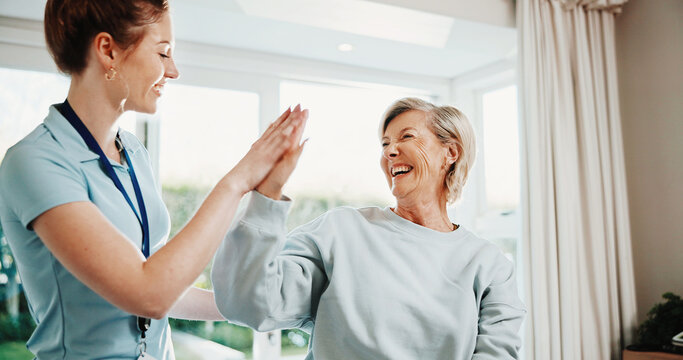 Physiotherapist, woman and laugh in office with high five, recovery goals and complete injury treatment. Physical therapist, happy mature person and celebration with rehab success, wellness and help.