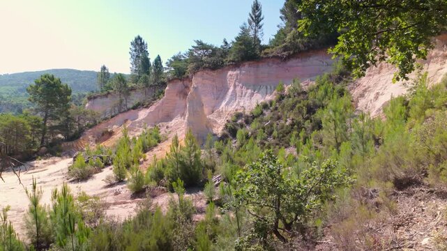 Rock cliffs in the Colorado Provencal, a spectacular semi-natural landscape of ancient ochre quarries located next to the village of Rustrel , France. Steady shot.