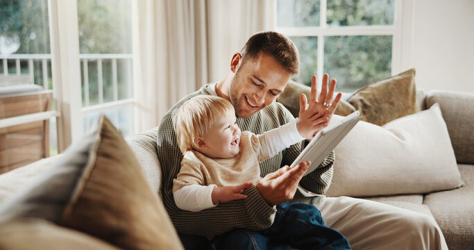 Dad, baby and high five with tablet on sofa for elearning video, bonding or smile in living room. Man, father and child with tech, movies and streaming subscription with funny cartoon in family house