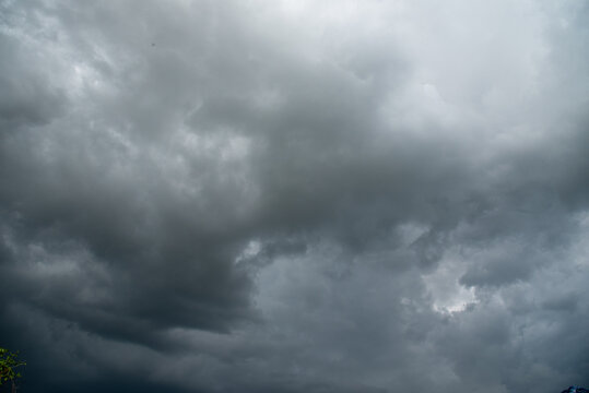 Dark gray sky cloudy environment. Meteorology danger windstorm disasters climate. Dramatic dark storm rain clouds black sky background. Dark cloudscape storm disaster gloomy gray cloud sky. Nimbus