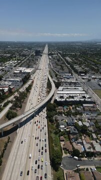 Vertical drone shot of heavy traffic on Interstate 405 freeway in Los Angeles, California