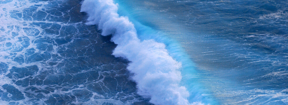 Banner Tropical sea beach Seascape dark background wave splash on rock. Seascape dark ocean background wave splash on rock. Water Surface blue wave pattern. Tropical sea beach in summer seaside