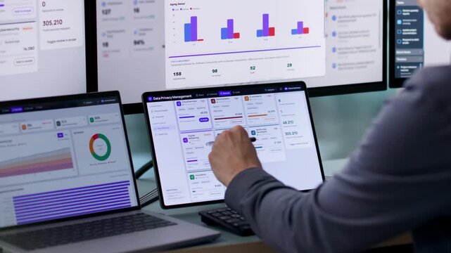 Data Privacy Officer Reviews Compliance Reports On Laptop