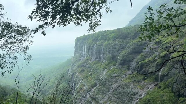 Spectacular 4K landscape of a windy valley in the Western Ghats with clouds, forests, and green mountains.