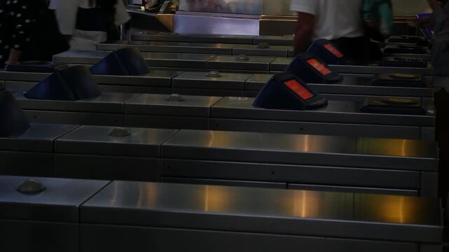 Editorial July 06 2026 &mdash; Commuters Passing Through Automatic Ticket Gate Turnstiles at BTS Skytrain Station, Bangkok Thailand Public Transportation