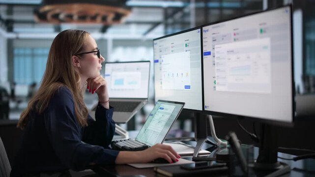 Payroll Manager Reviewing Employee Salary Data On Laptop