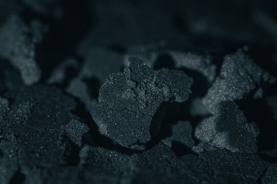Macro Charcoal Texture Closeup: Selective Focus on Rough, Porous Fragments, Natural Material Detail for Abstract and Artistic Backgrounds