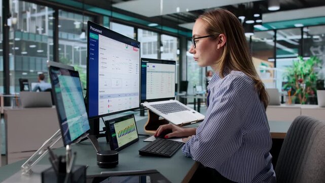 Procurement Manager Reviews Vendor Contracts Using Software