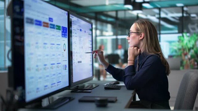 Urban Planner Reviewing Municipal Permit Applications On Computer