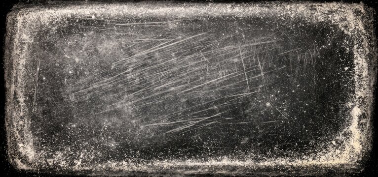 Close-up of a scratched and weathered metallic surface with a distressed texture.