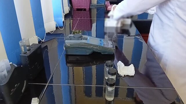 Adding DPD No 1 Chemical Tablet to Treated Water Sample for Free Residual Chlorine Colorimetric Test, Water Quality Analysis
